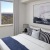 rendering of bedroom showing natural light through window and large open space for bed and furniture