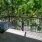 Outdoor Balcony with black railing and greenery outside