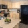 rendering of kitchen showing well covered lighting and ample counterspace